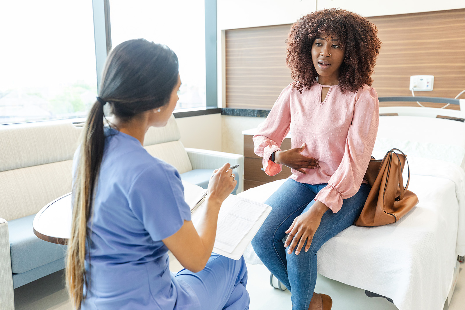 Woman speaks to a doctor