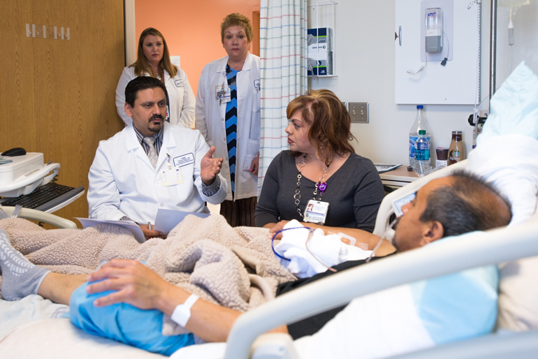 Medical interpreter Veronica Maldonado listens to physician Faheem Jukaku as he explains recent test results to David. Maldonado translates the information from English to Spanish for David. (Heidi de Marco/CHL)