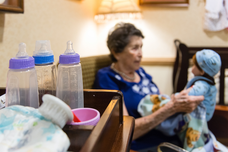 The nursery area is set up like a baby’s room with bottles, blankets and a crib. (Heidi de Marco/KHN)
