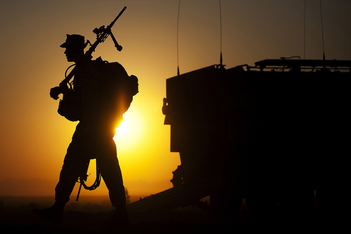A machine gunner prepares to load an amphibious assault vehicle.