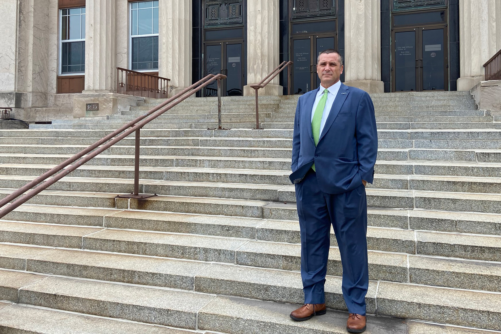 Thomas McDermott Jr. is seen standing on steps outside the city hall in Hammond, Indiana.