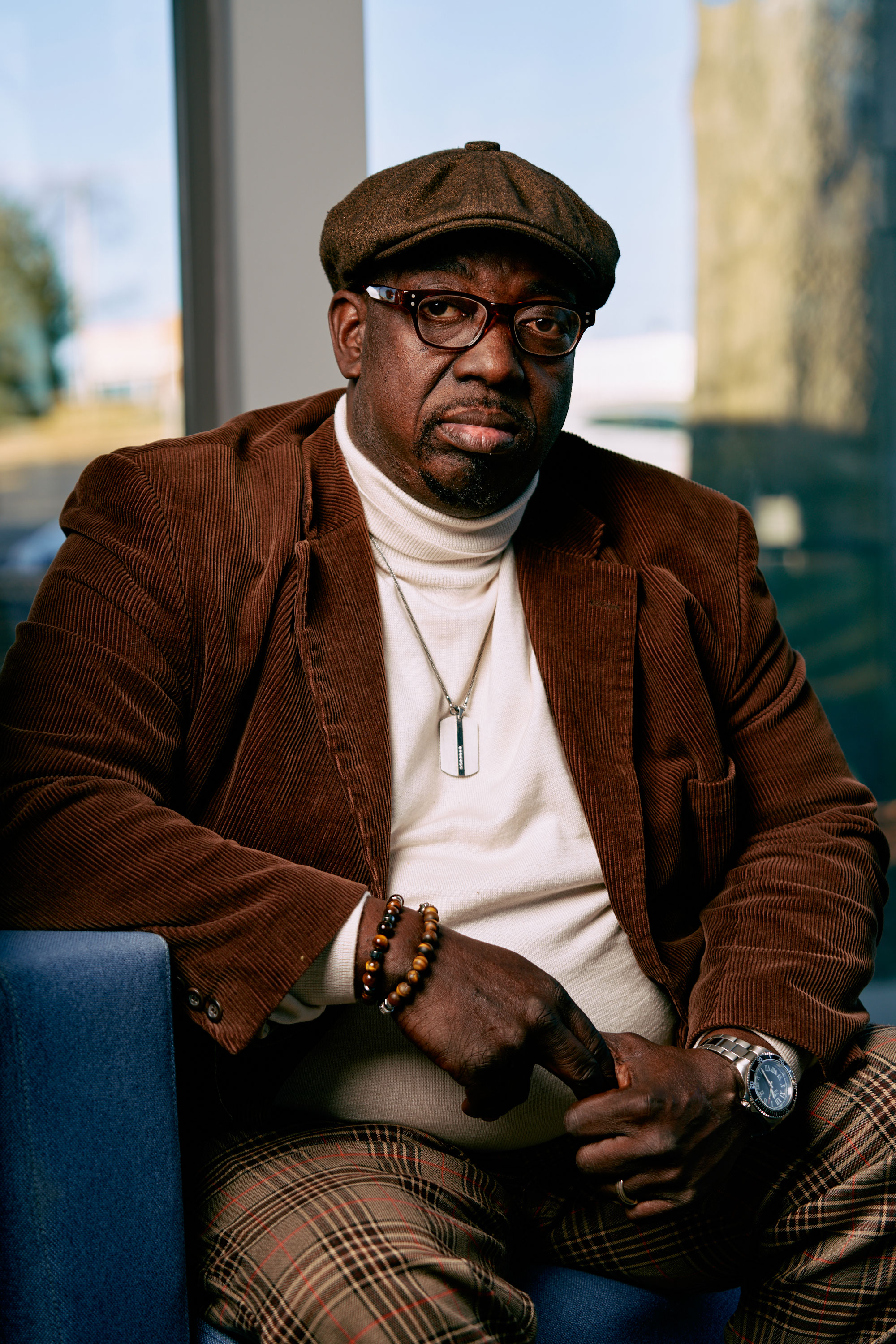 A portrait of a seated man.