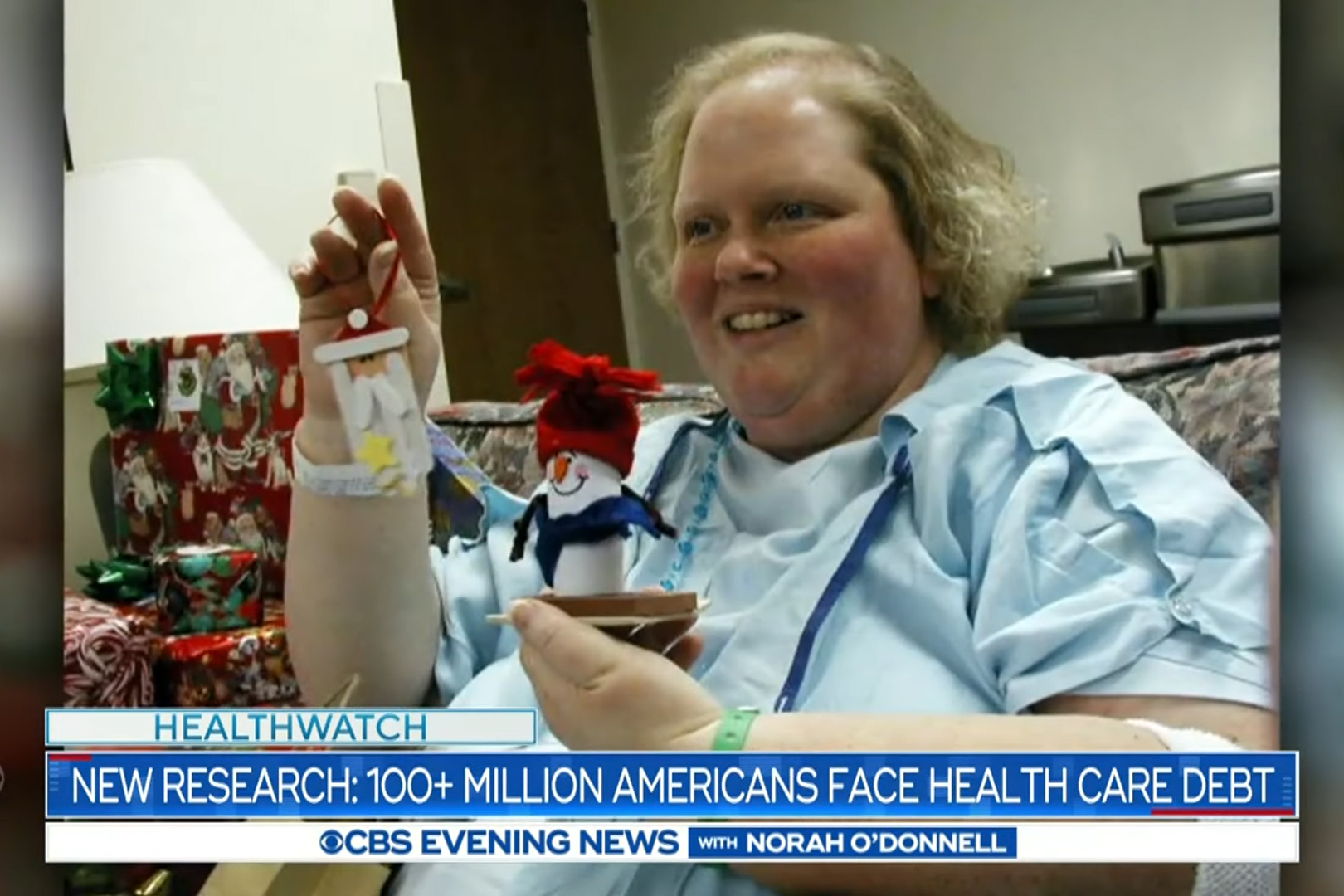 A screenshot of a newscast shows a photo of a woman in a hospital gown. Text on the screen reads, "New research: 100+ million Americans face health care debt."