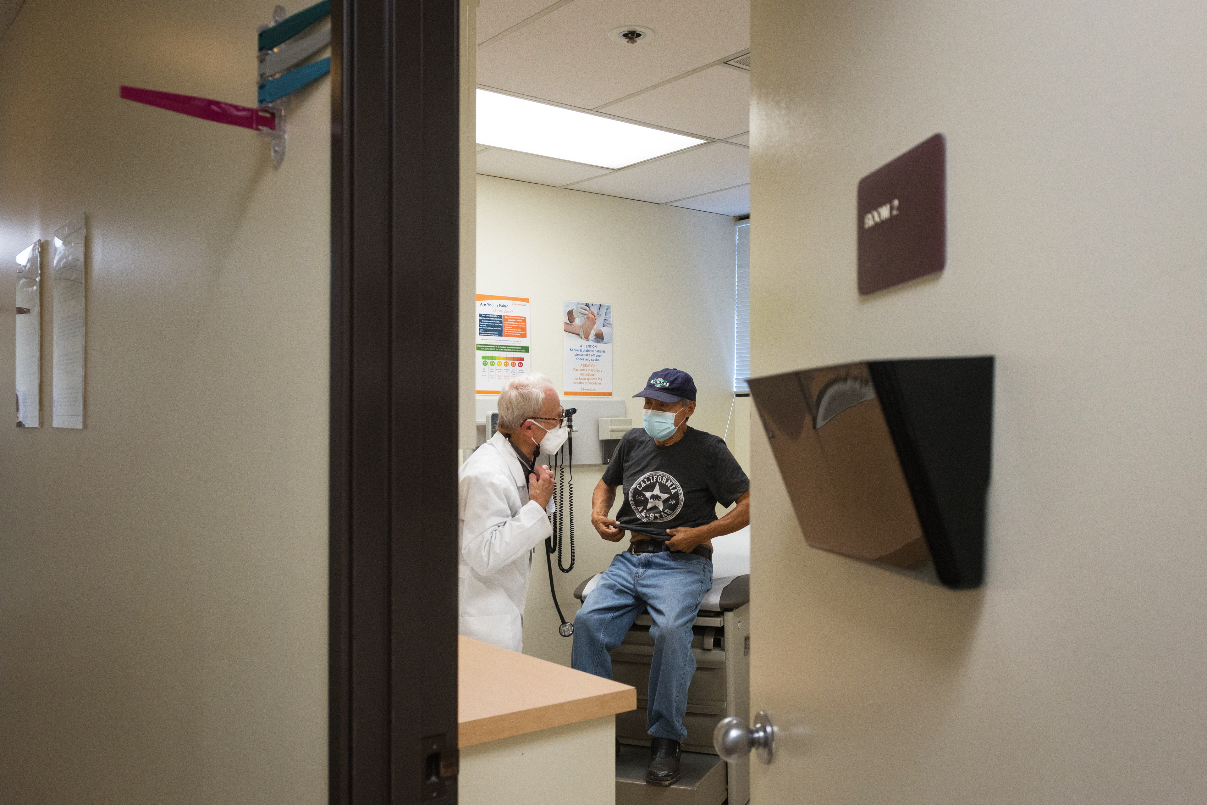 A photo shows a doctor examining a patient.