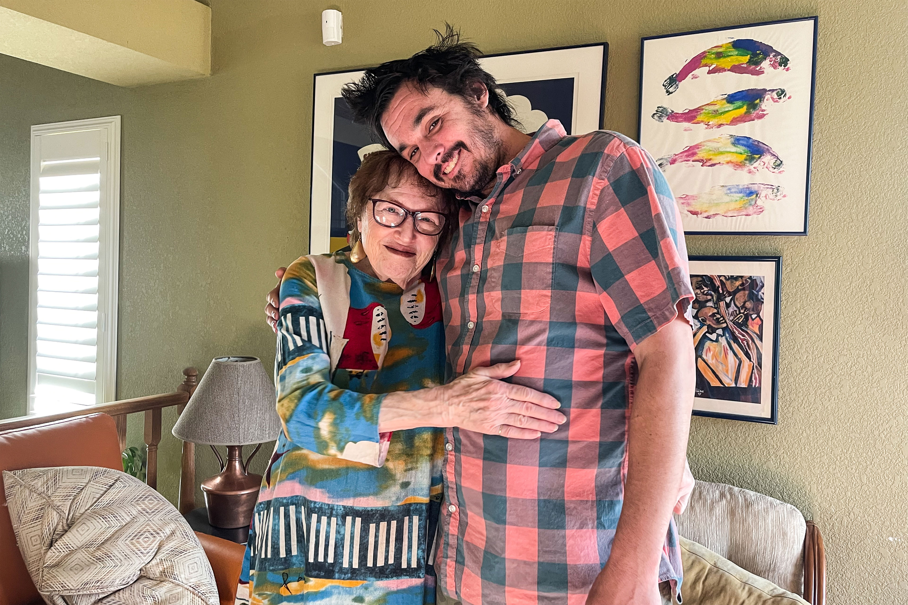 A photo shows Susan and Daniel Goodman hugging while posing for a picture.