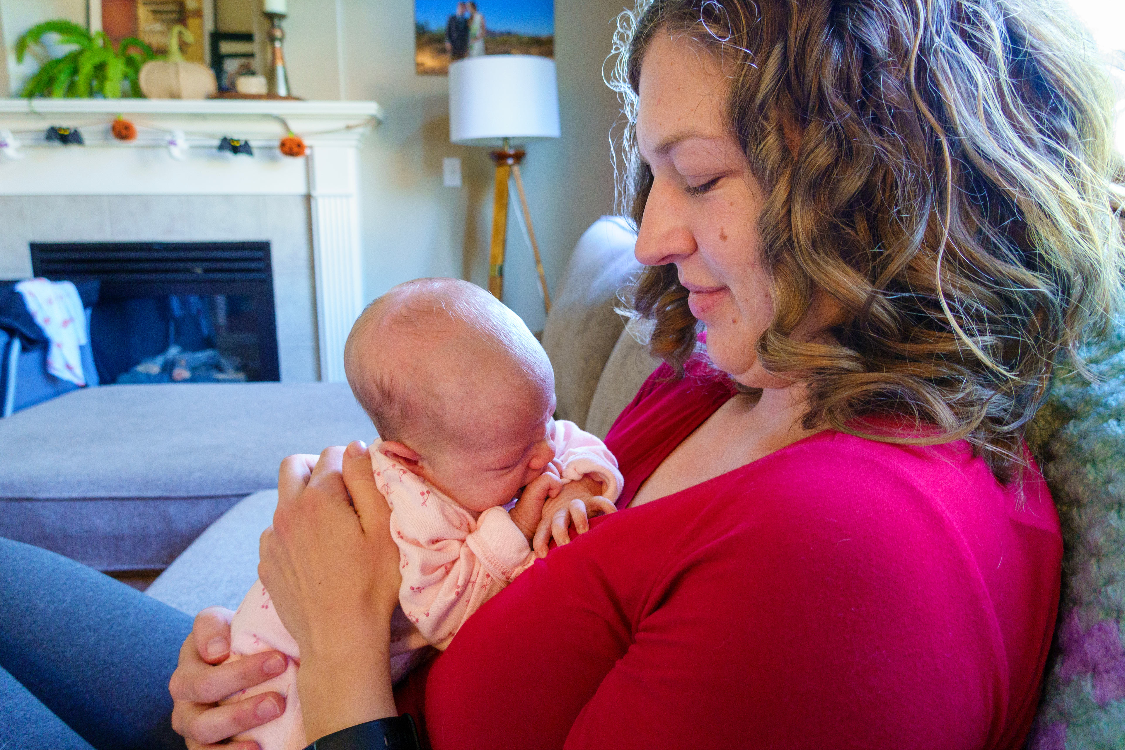 A photo of a woman holding her infant child.