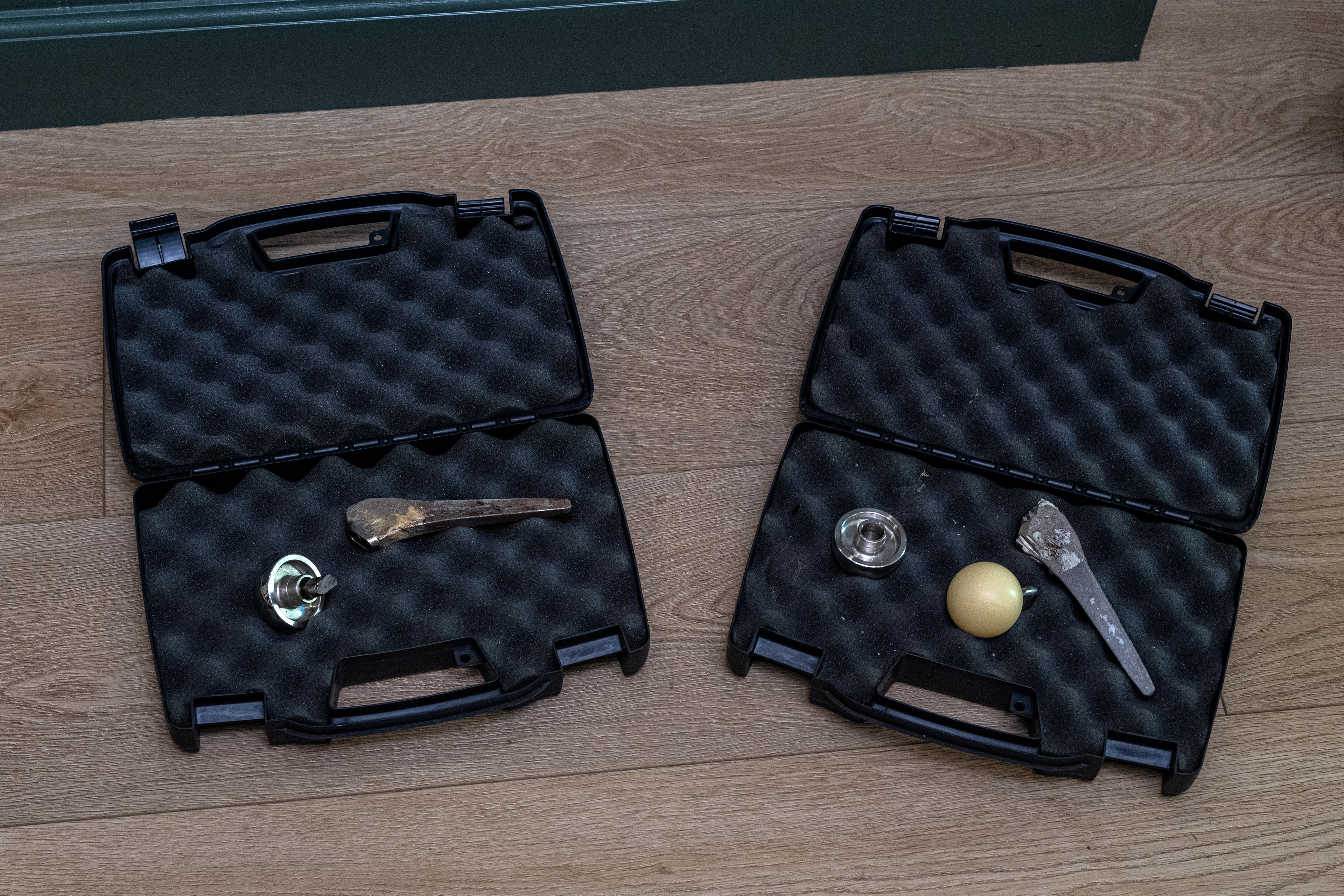 Two opened, padded cases show broken Profemur implants inside them.