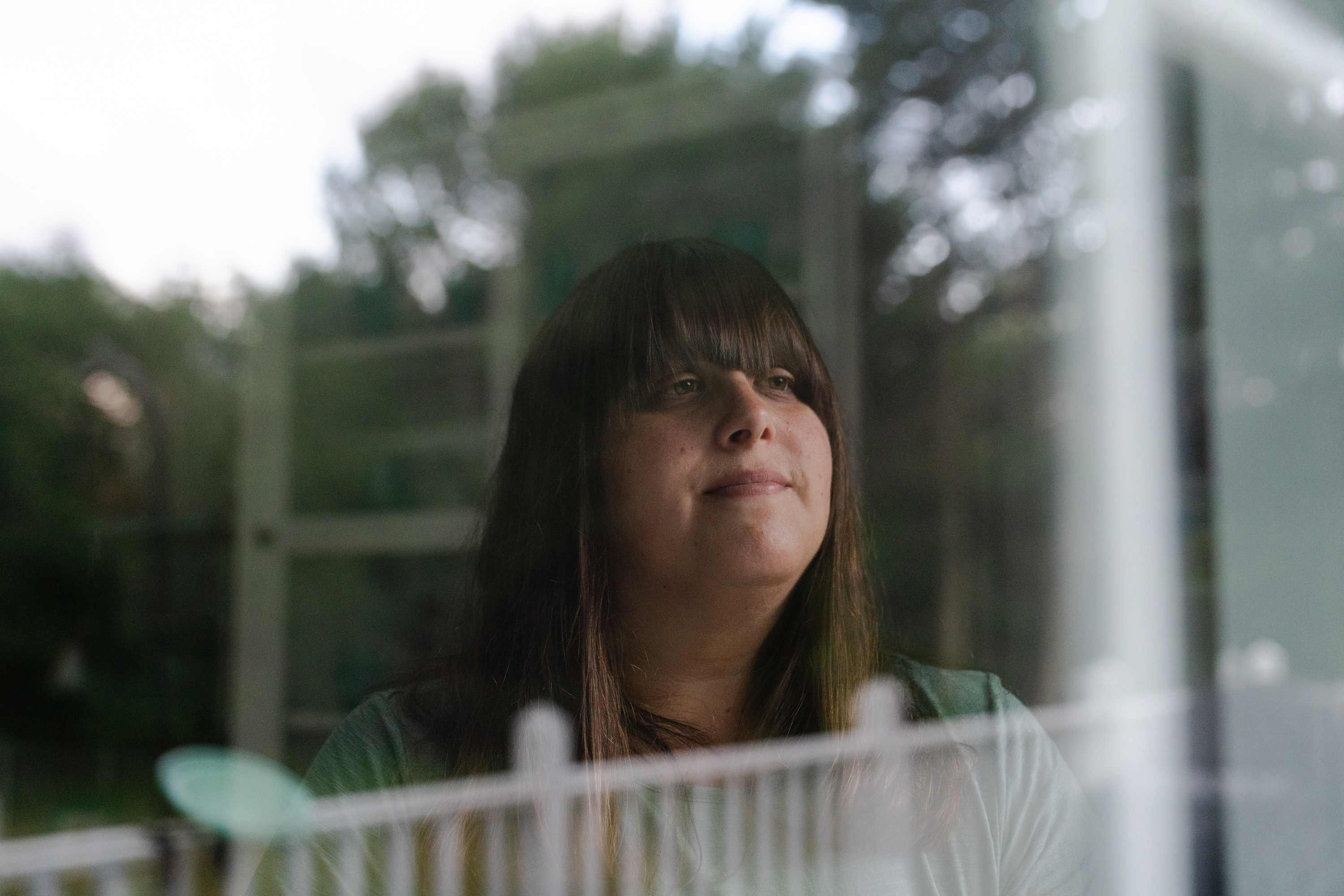 A portrait of Erica Kahn looking out the window.
